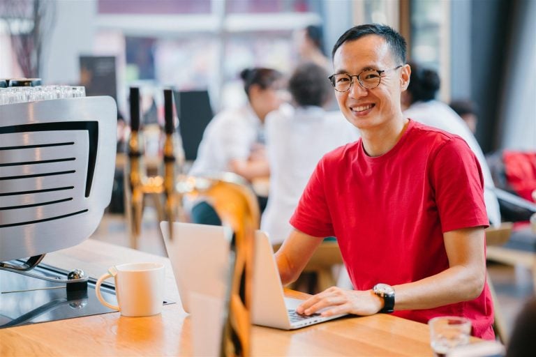 Male holding a laptop